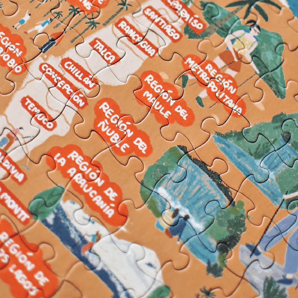 Caja de puzzle de 200 piezas ilustrando regiones y ciudades de Chile.