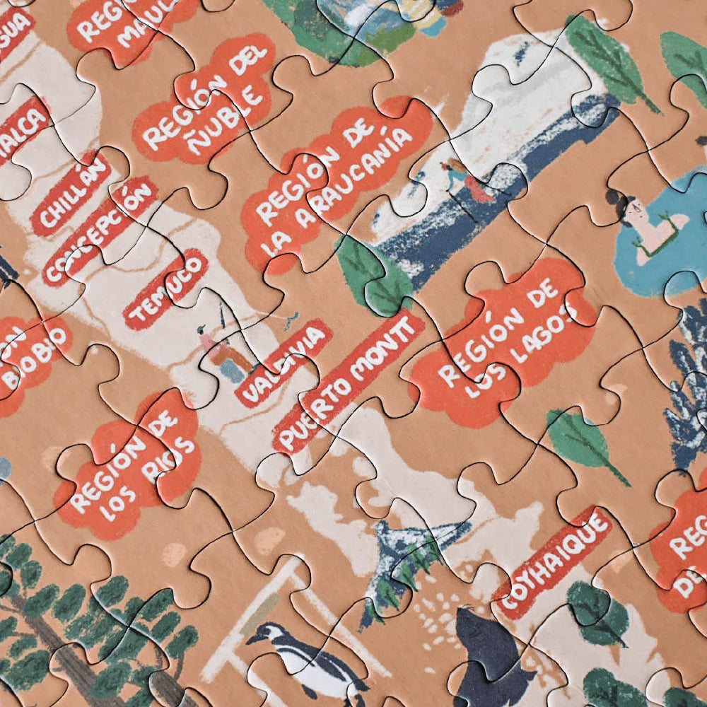 Caja de puzzle de 200 piezas ilustrando regiones y ciudades de Chile.